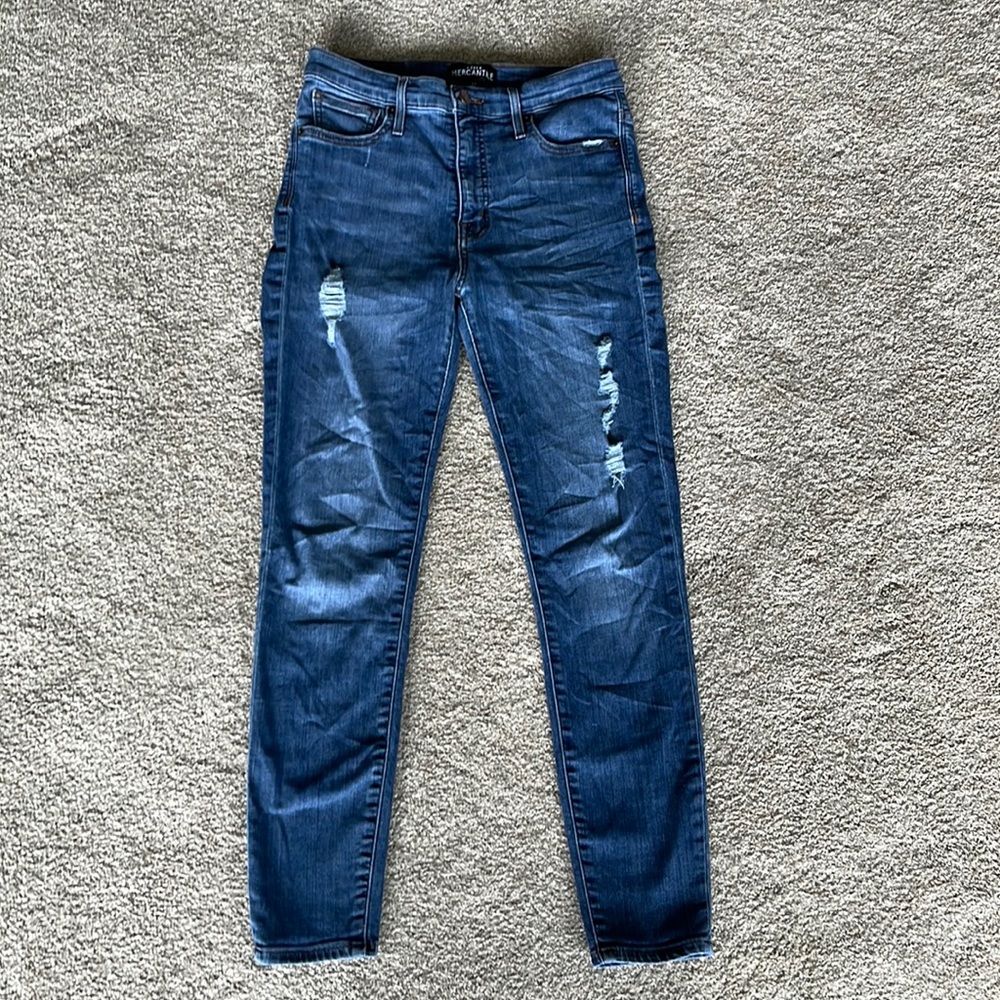 J. Crew blue jeans with a couple holes